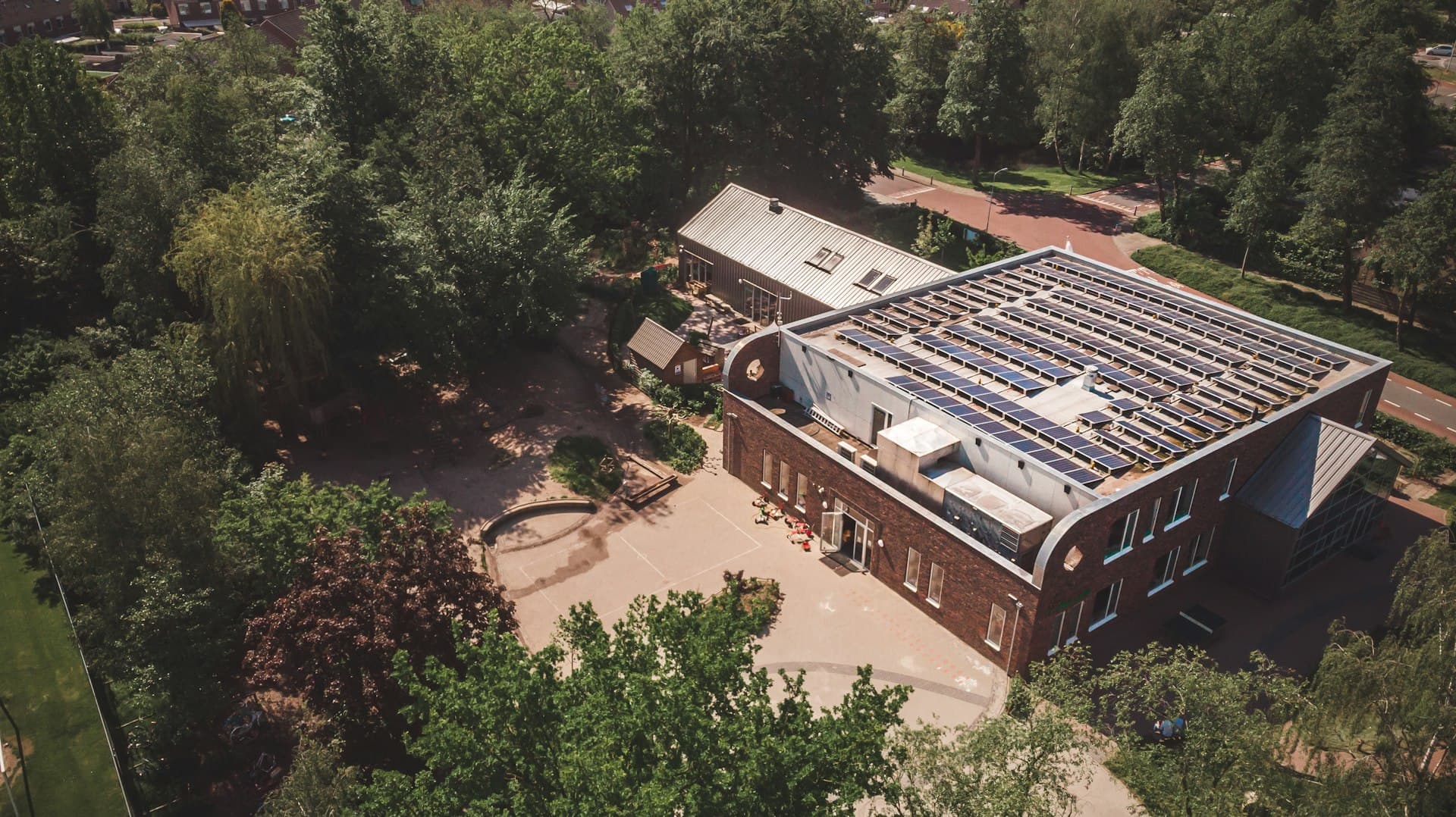 Aerial view of solar panels covering a commercial building rooftop
